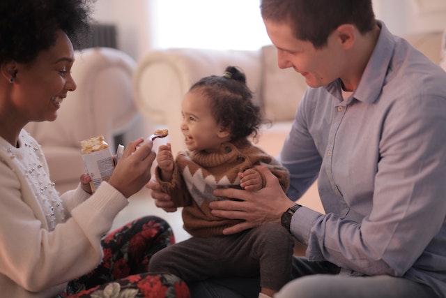 Parents feeding their baby